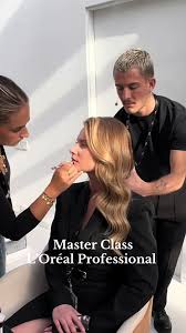 a woman getting her makeup done